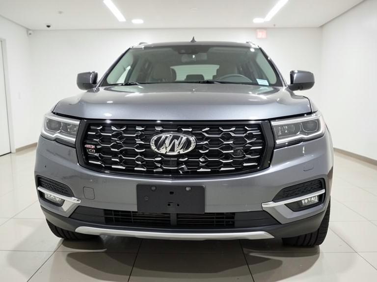 The same SUV front end repaired with aligned hood and grille